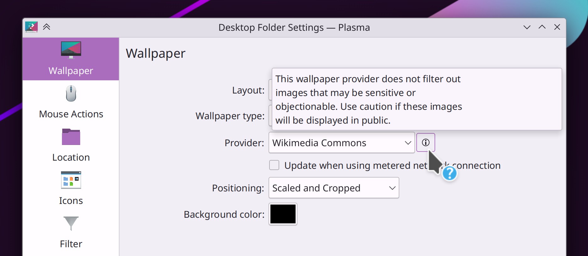 Plasma wallpaper chooser window showing Wikimedia picture of the day provider with a warning tooltip that says, "This wallpaper provider does not filter out images that may be sensitive or objectionable. Use caution if these images will be displayed in public."