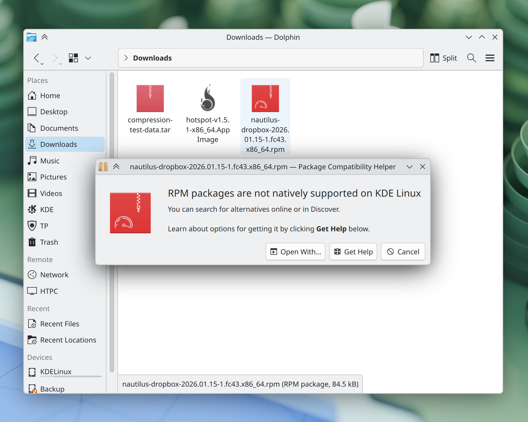 A dialog informs the user that RPM packages are not supported on KDE Linux, and suggests alternative courses of action
